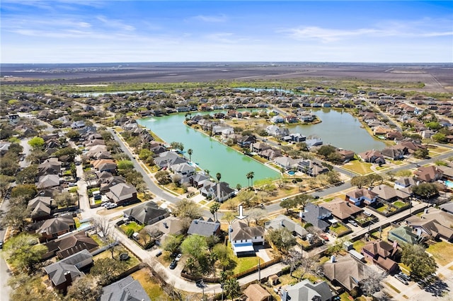 birds eye view of property with a residential view and a water view