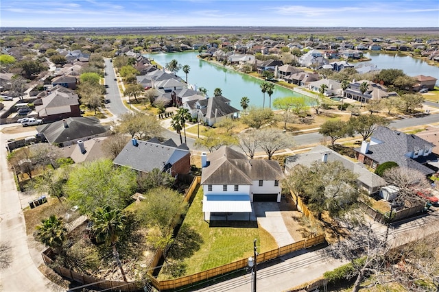 aerial view featuring a residential view and a water view