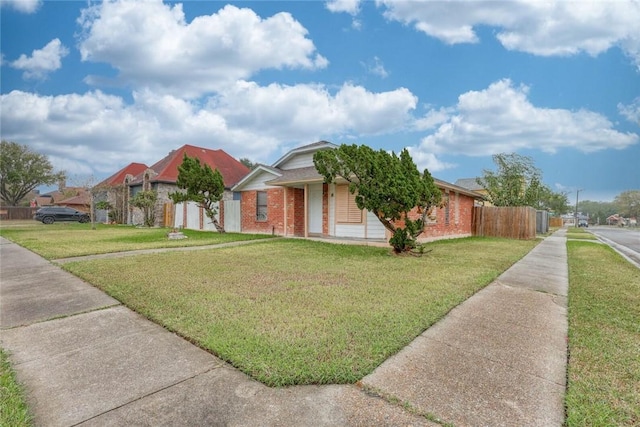 ranch-style home with a front lawn