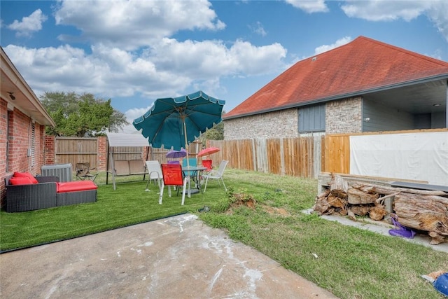 view of yard with a patio and central AC