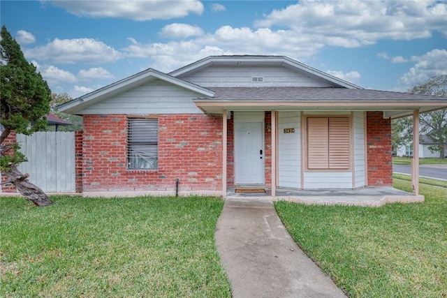 bungalow with a porch and a front yard