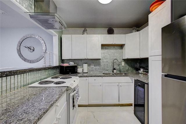 5434 Alejandro St, Corpus Christi, TX 78415 - kitchen with freestanding refrigerator, electric stove, range hood, tasteful backsplash, and white cabinetry