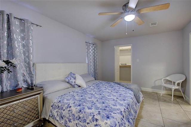 bedroom with ceiling fan and light tile patterned flooring