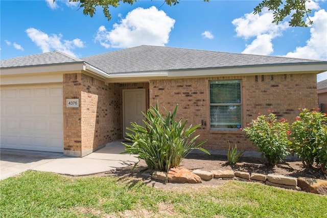 4376 Summer Wind Dr, Corpus Christi, TX 78413 - ranch-style home featuring brick siding, a garage, and a shingled roof