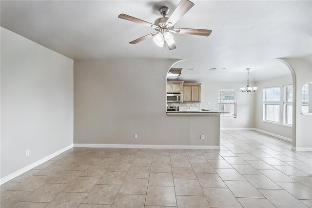 4376 Summer Wind Dr, Corpus Christi, TX 78413 - unfurnished living room with a chandelier, a ceiling fan, and light tile patterned flooring