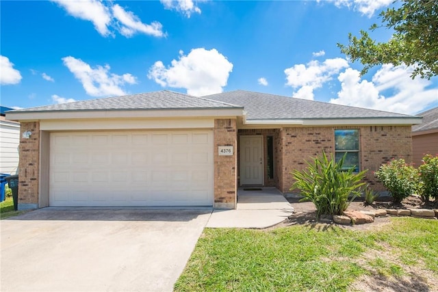 4376 Summer Wind Dr, Corpus Christi, TX 78413 - ranch-style house with brick siding, concrete driveway, and a garage