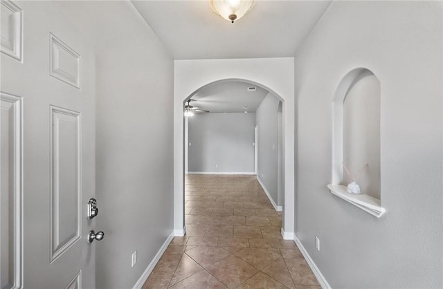 4376 Summer Wind Dr, Corpus Christi, TX 78413 - hallway with arched walkways and tile patterned flooring