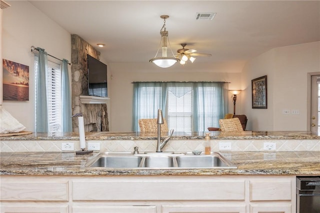 kitchen with pendant lighting, ceiling fan, and sink