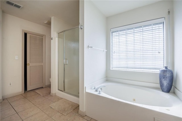 bathroom featuring a garden tub, a closet, visible vents, a shower stall, and tile patterned flooring