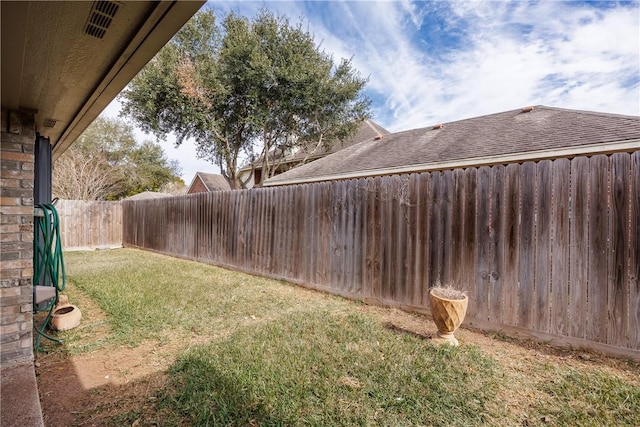 view of yard with a fenced backyard