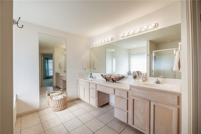 bathroom with vanity, an enclosed shower, and tile patterned flooring