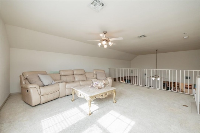 living room with visible vents, vaulted ceiling, and a ceiling fan