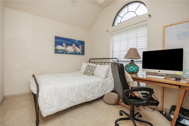 bedroom featuring vaulted ceiling, baseboards, and light colored carpet