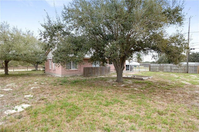 view of yard with fence