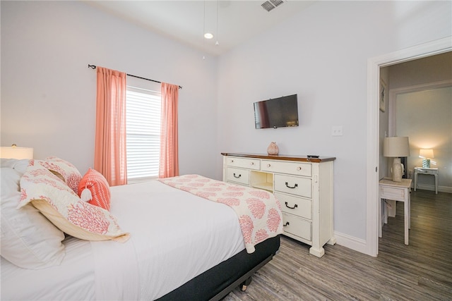 bedroom featuring hardwood / wood-style flooring