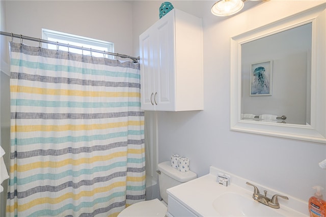 full bathroom featuring toilet, shower / tub combo, and vanity