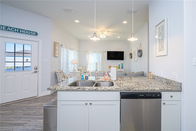 kitchen featuring dishwasher, a healthy amount of sunlight, and white cabinets