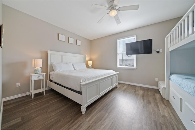 bedroom with ceiling fan and dark hardwood / wood-style flooring