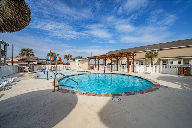 view of pool with a pergola and a patio area