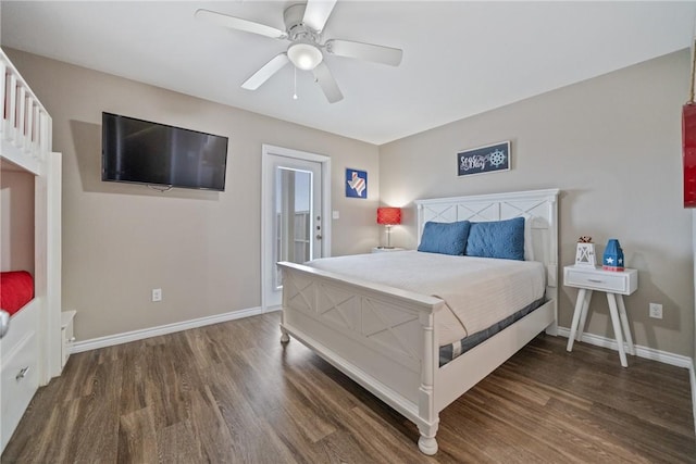 bedroom with dark hardwood / wood-style flooring and ceiling fan