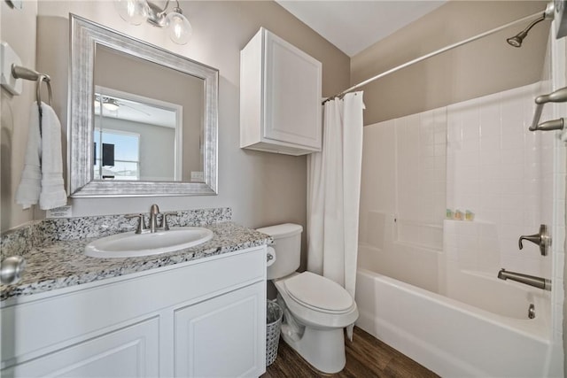 full bathroom with vanity, toilet, shower / tub combo, and hardwood / wood-style floors