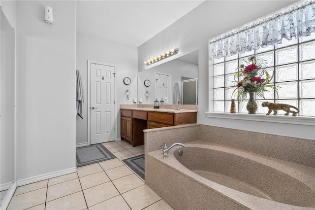 bathroom featuring double vanity, a bath, tile patterned flooring, a shower stall, and a sink