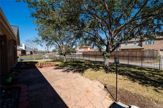 4302 Pontchartrain Dr, Corpus Christi, TX 78413 - fenced backyard with a patio area