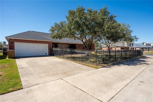 ranch-style home featuring a fenced front yard, brick siding, central air condition unit, concrete driveway, and a garage