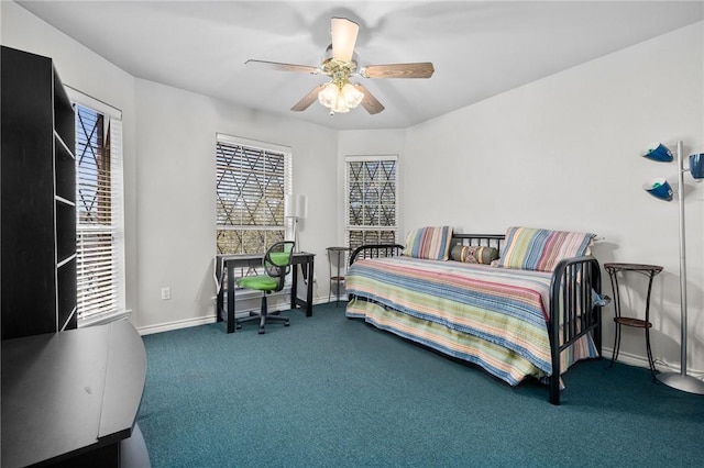 carpeted bedroom featuring a ceiling fan and baseboards