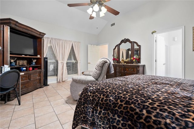 bedroom featuring a ceiling fan, lofted ceiling, visible vents, and light tile patterned floors