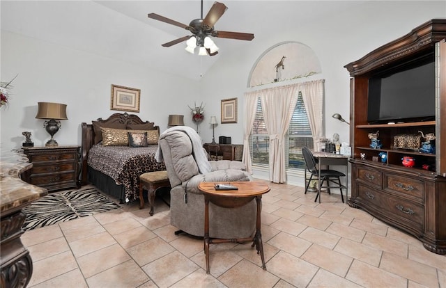 bedroom with lofted ceiling, light tile patterned flooring, and a ceiling fan