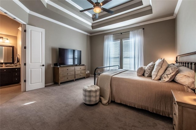 bedroom with ceiling fan, carpet, connected bathroom, ornamental molding, and a raised ceiling