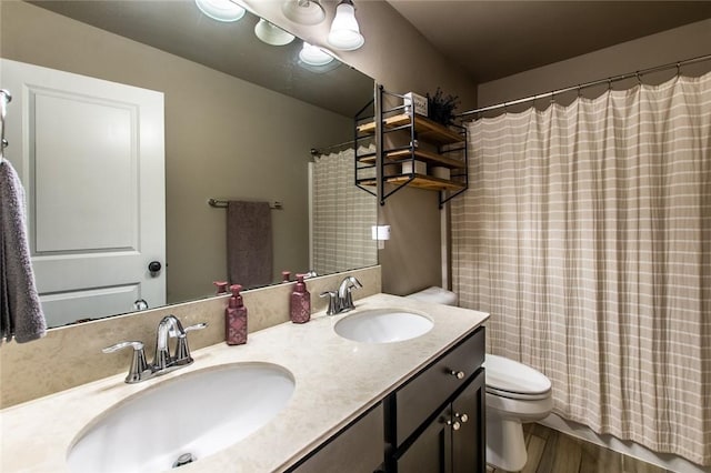 full bathroom featuring vanity, wood-type flooring, toilet, and shower / tub combo with curtain