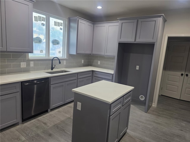 714 Mereet Dr, Corpus Christi, TX 78418 - kitchen featuring gray cabinetry, a sink, dishwashing machine, and tasteful backsplash