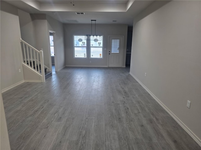 714 Mereet Dr, Corpus Christi, TX 78418 - unfurnished living room with baseboards, dark wood-style floors, and stairway
