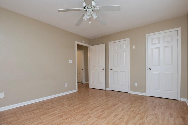 1005 Ronald Dr, Corpus Christi, TX 78412 - unfurnished bedroom featuring light wood-style flooring, baseboards, and a ceiling fan