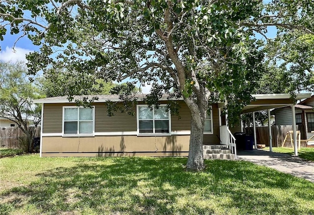 1005 Ronald Dr, Corpus Christi, TX 78412 - manufactured / mobile home featuring an attached carport and driveway