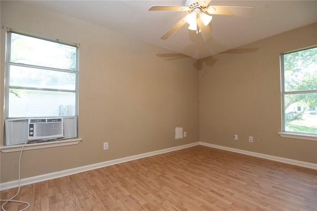 1005 Ronald Dr, Corpus Christi, TX 78412 - empty room with light wood finished floors, cooling unit, baseboards, and a ceiling fan