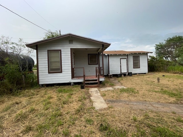 view of front of house with an outbuilding