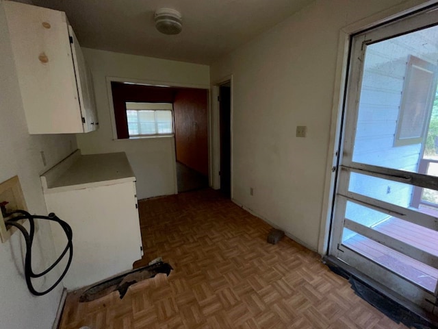 clothes washing area with washer hookup and light parquet floors