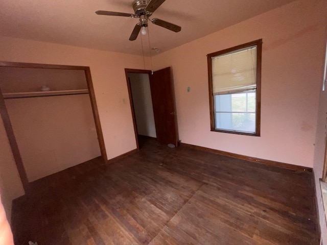 unfurnished bedroom with a closet, ceiling fan, and dark hardwood / wood-style floors