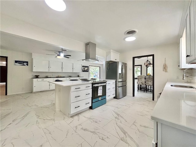 kitchen featuring visible vents, electric range, extractor fan, stainless steel refrigerator with ice dispenser, and a sink