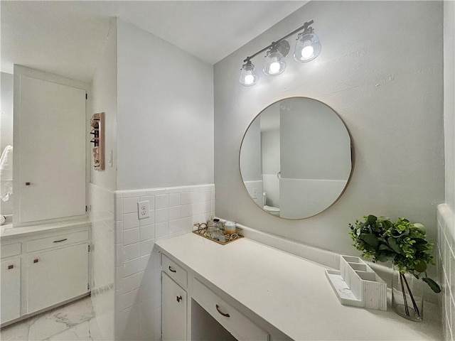 bathroom featuring vanity and marble finish floor