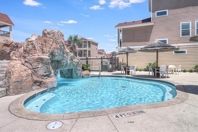 view of pool featuring a patio, fence, and a fenced in pool