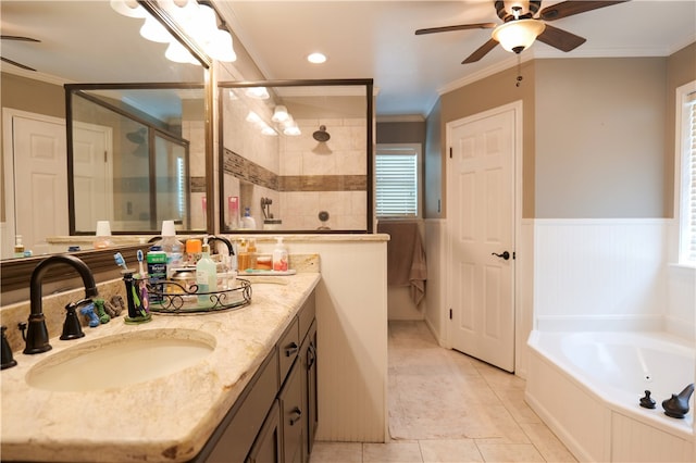 bathroom featuring tile patterned flooring, vanity, a healthy amount of sunlight, and crown molding