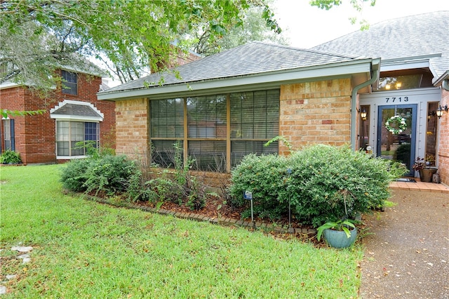 exterior space with a yard