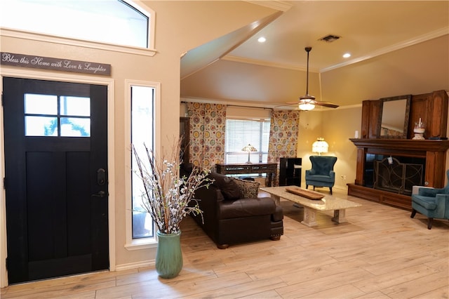 entryway featuring plenty of natural light, light hardwood / wood-style flooring, and crown molding