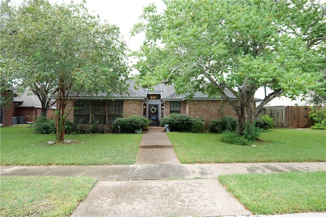 ranch-style home with a front yard