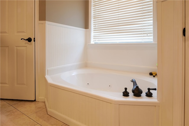 bathroom featuring a bath and tile patterned flooring