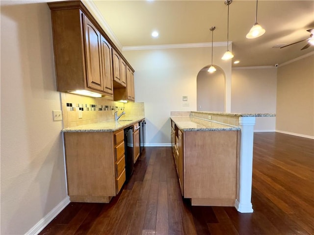 kitchen with pendant lighting, light stone countertops, kitchen peninsula, and dark wood-type flooring